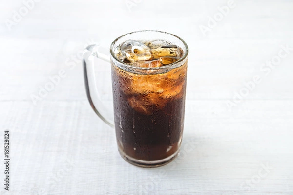 Obraz Glass of cola with ice on wood baord
