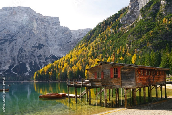 Fototapeta Amazing view of Braies Lake - Lago di Braies - with autumn forest and mountains reflected in surface lake water Dolomites Alps, Italy