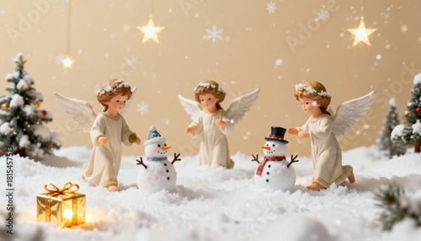 Obraz Tiny angels and snowmen atop decorated Christmas trees in a festive winter scene.