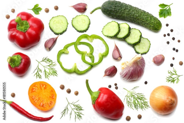 Fototapeta mix of sliced cucumber, garlic, sweet bell pepper and parsley isolated on white background. top view