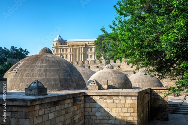 Obraz Exterior view of an old Turkish bathhouse in Baku Azerbaijan with domed roof and stone walls under a sunny blue sky.
