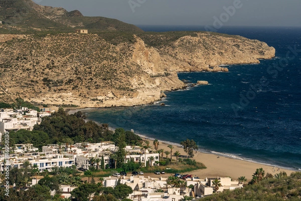 Fototapeta Coastal village of Agua Amarga and surrounding cliffs, Cabo de Gata.