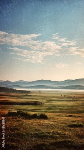 Fototapeta Serene Foggy Grasslands Expanding Across a Vast and Lonely Landscape
