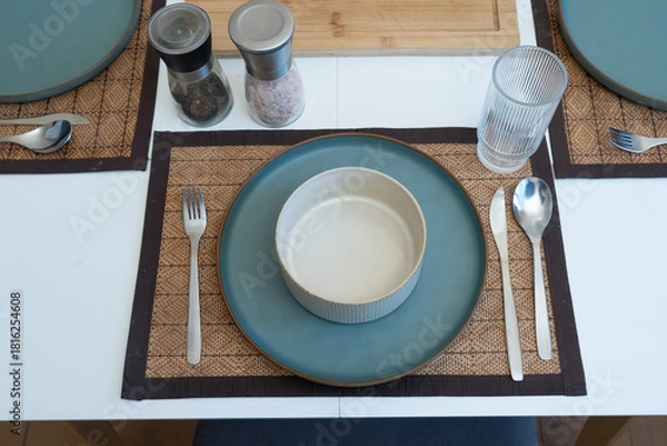 Obraz Cozy table setting with ceramic dinnerware and calm morning ambiance, capturing a peaceful dining mood.