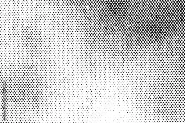 Fototapeta Halftone texture with dense black dots transitioning to lighter areas, forming a gradient on a transparent background.