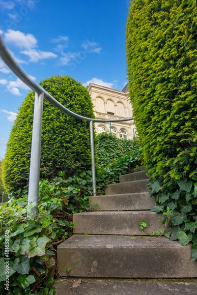 Fototapeta A tight view of stairs leading upward toward a building in Baden Baden