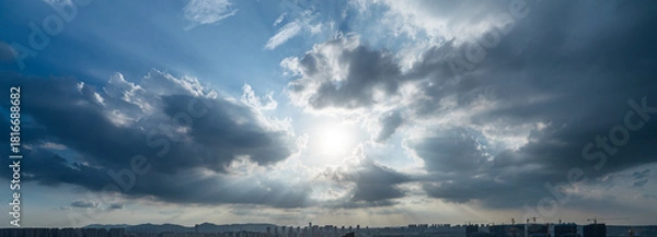 Obraz Sun rays through dramatic clouds