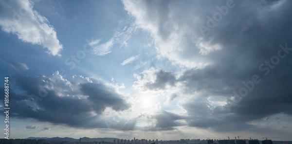 Obraz Sun rays through dramatic clouds