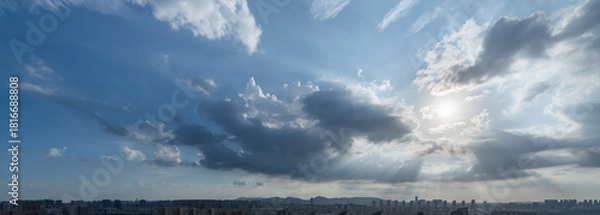 Obraz Sun rays through dramatic clouds