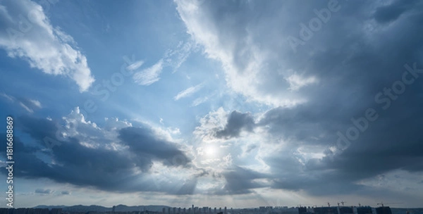 Obraz Sun rays through dramatic clouds