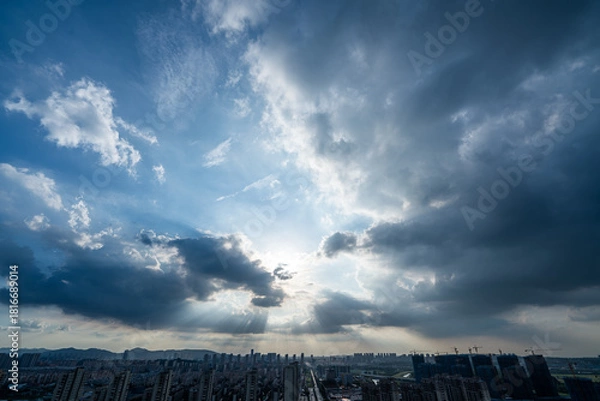 Obraz Sun rays through dramatic clouds