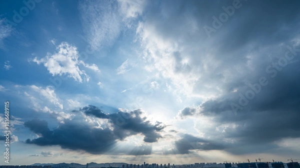 Obraz Sun rays through dramatic clouds