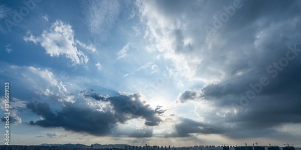 Obraz Sun rays through dramatic clouds