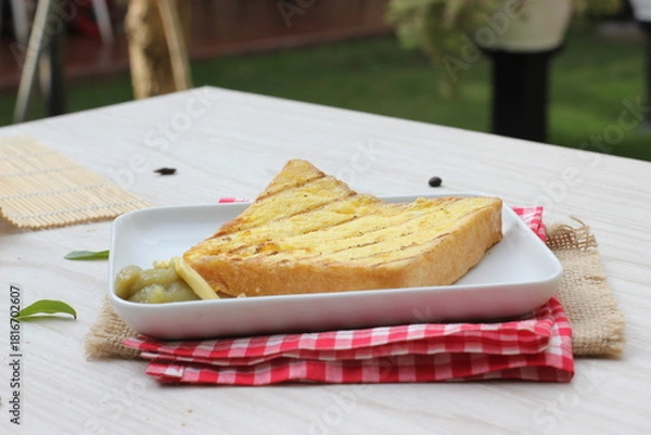 Obraz Toasted bread on a table with a natural background 