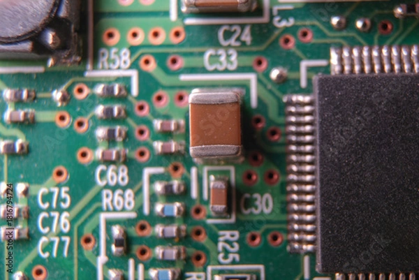 Obraz Surface mount technology capacitor on the electronic board. Selected focus.