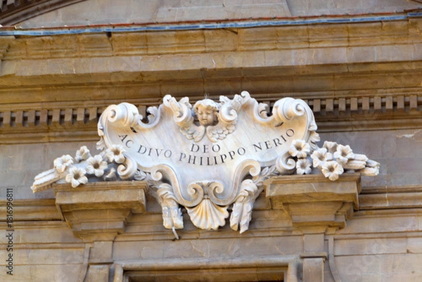 Obraz Ornamental Stone Crest With Floral Carvings And Latin Inscription On Historic Building