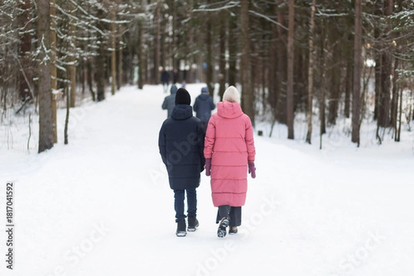 Fototapeta Nordic walking. People are practicing Nordic walking in the park.