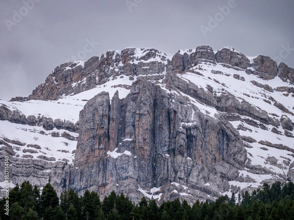 Fototapeta Extreme close up of heavily textured layered limestone rock face