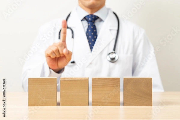 Obraz 説明をする医師と無地のブロック