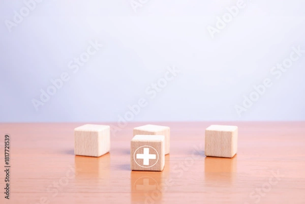 Fototapeta Wooden blocks with a highlighted plus symbol representing positivity, leadership, selection, and growth concepts in business strategy, decision-making, and personal development