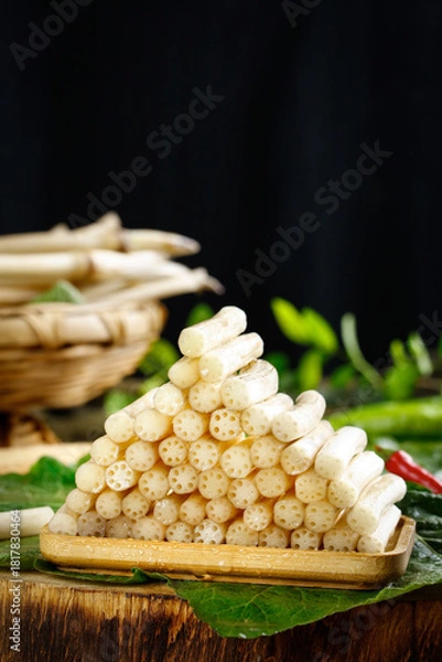 Obraz Fresh Lotus Root Vegetable Display on Bamboo Tray with Green Leaves - Traditional Asian Cooking Ingredient