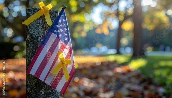 Obraz American flag waving proudly in the wind with yellow ribbons, symbolizing support and remembrance
