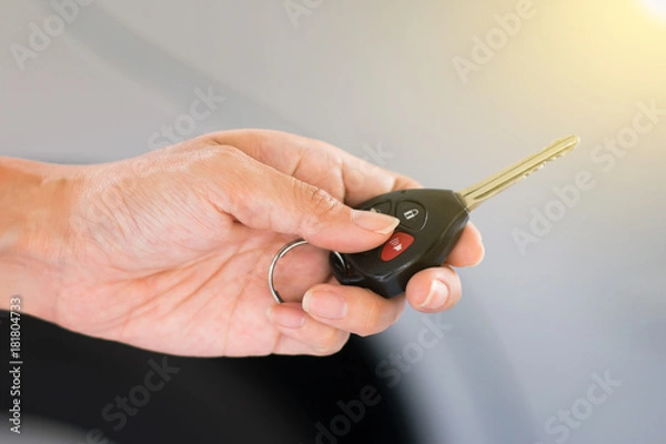 Obraz Hand holding remote car key.