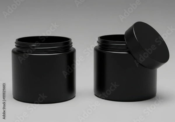 Fototapeta Two matte black plastic cosmetic jars with lids one open showcasing inner packaging potential for beauty products