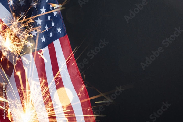 Fototapeta USA flag background with sparkler on black for Veterans Day, Memorial Day, Independence Day, and 4th of July designs.