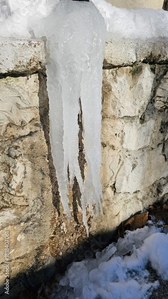 Fototapeta Close-up view of a giant natural ice stalactite in Valsassina
