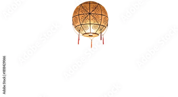 Obraz A decorative spherical lantern with intricate patterns and tassels, hanging against a plain white background.