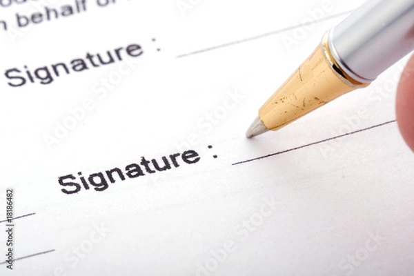Obraz Detail view of the signature box of a contract with a pen.