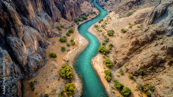 Obraz aerial view of winding river through mountain