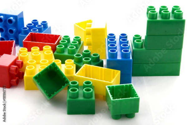 Obraz vibrant collection of plastic building blocks in white background
