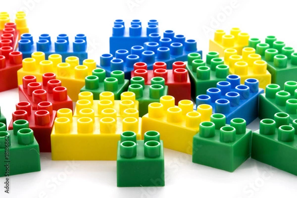 Obraz vibrant collection of plastic building blocks in white background