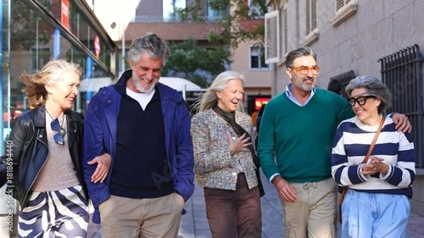 Obraz Group of seniors walking and laughing in city