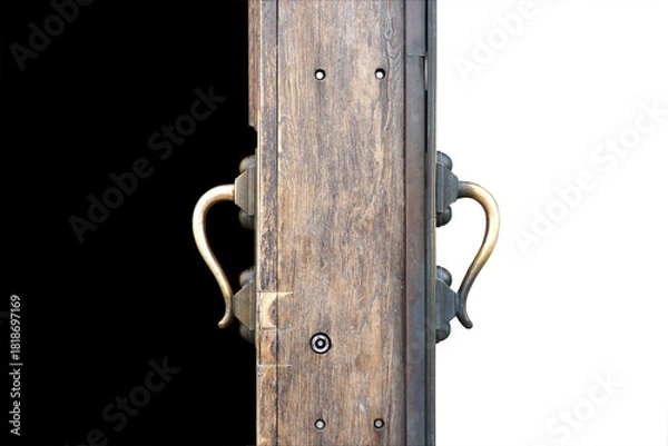 Obraz An open thick wooden door, like a border between light and darkness.