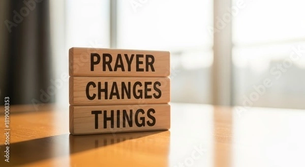 Fototapeta Empowering Words: Prayer Changes Things The phrase is displayed prominently on stacked wooden blocks, conveying a message of faith and transformation. 