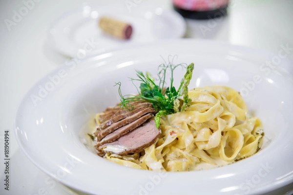 Obraz Chef s specialty presented in restaurant on served table