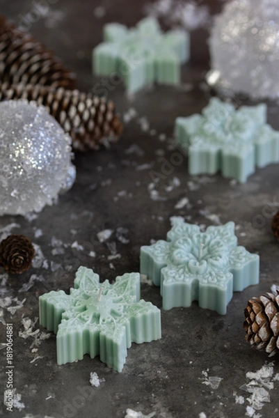 Obraz Snowflake shape candles. Mistletoe branches close up on gray background. decor for Christmas, Advent, Yule, New Year holidays.