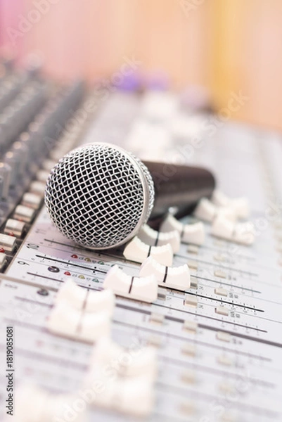 Obraz dynamic microphone on audio mixing console. singing, recording concept