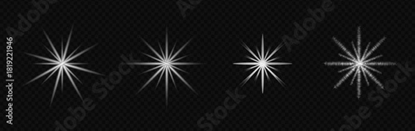 Fototapeta Four bright starburst light flares with glowing center on transparent background