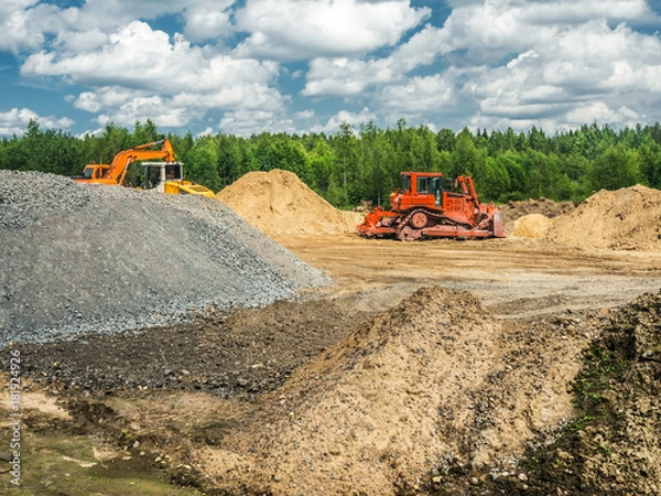 Obraz Jobsite With Machinery And Piles Of Dug Earth