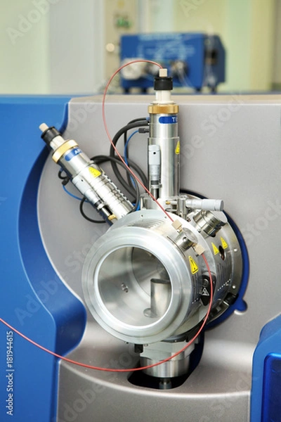 Fototapeta Adjust the mass spectrometer. The man analyzes the device for determining the masses of atoms. Device for the pharmaceutical industry. Ionic source of mass spectrometer.
