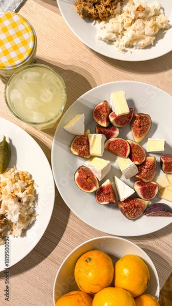 Fototapeta Zesty brunch tableau with creamy fig medley, citrus sunburst, Ukrainian Spyasennia vibes, and eclectic Litha festiveness in abundance