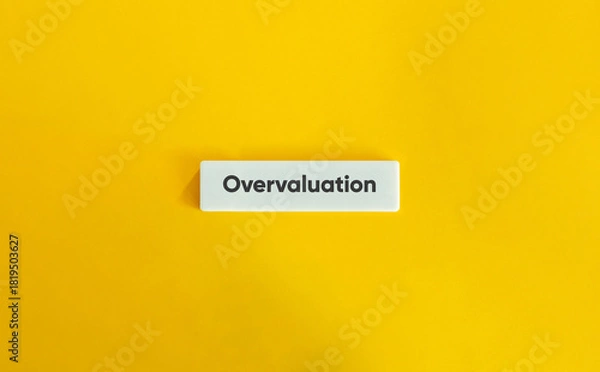 Fototapeta Overvaluation Word Tile Yellow Background Finance Business Stock Market Bubble Risk Assessment Investment Concept Graphic
