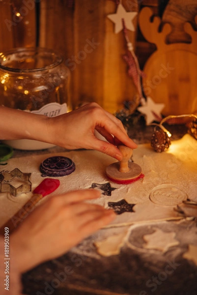 Obraz the hand of a woman baking Christmas cookies