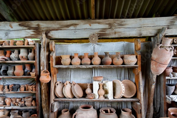Fototapeta Exhibition of pottery. Pottery. Set of clay pots. The ancient art of making pottery..