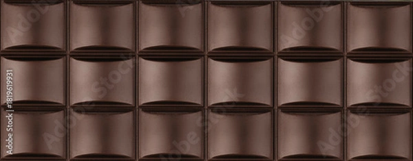 Obraz High resolution close-up image of a dark chocolate bar with detailed textured squares, background. The rich brown color, smooth surface