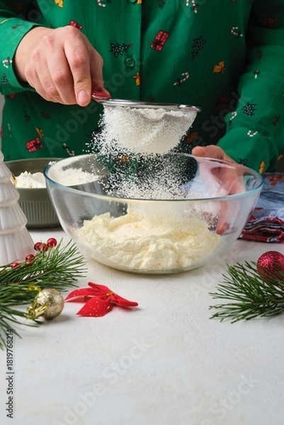 Fototapeta Step-by-step preparation of Candy Cane shortbread cookies in Christmas decor on a light concrete background. Merry Christmas! Traditional Christmas treats